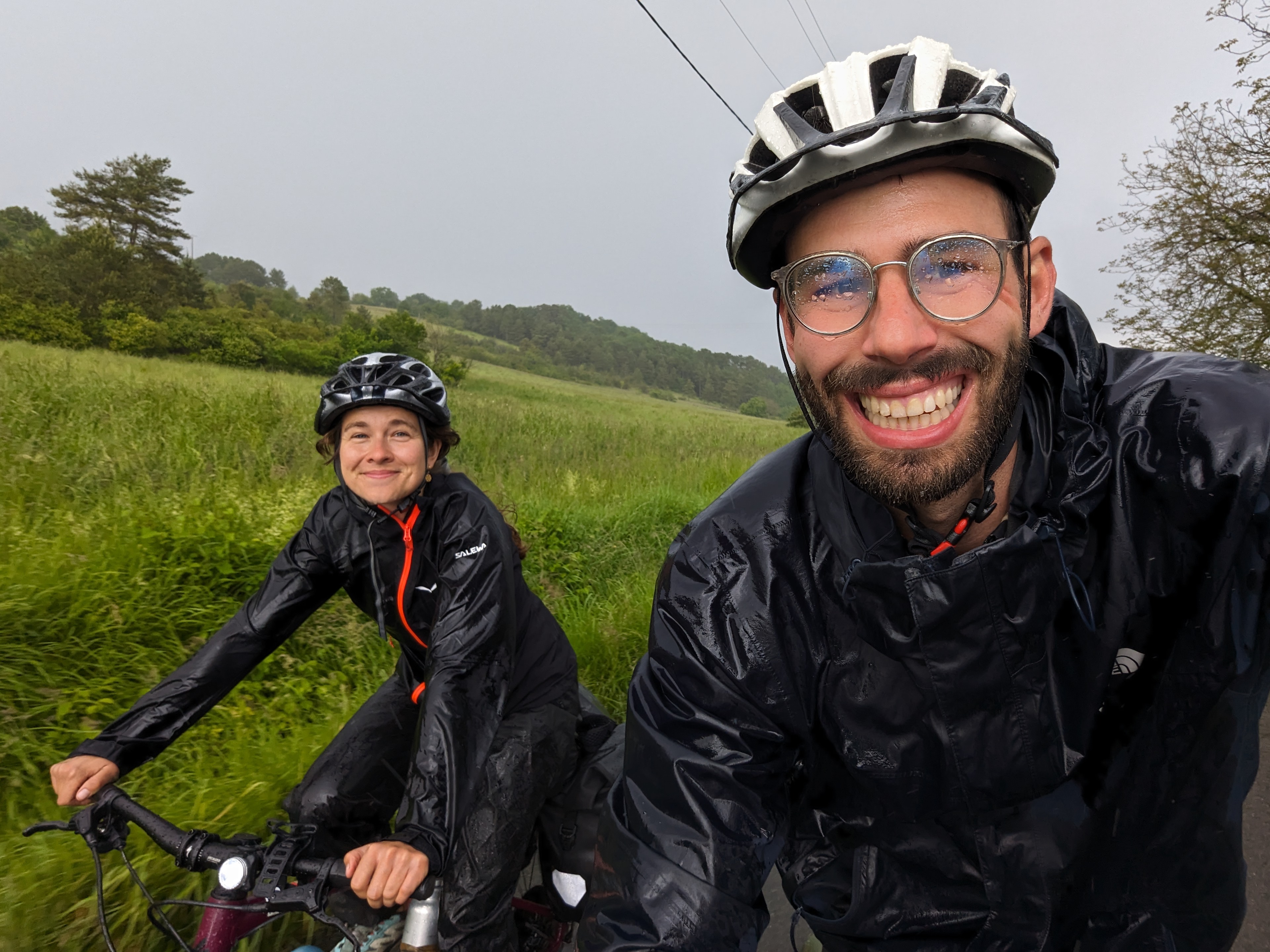 happy bikepackers in the rain